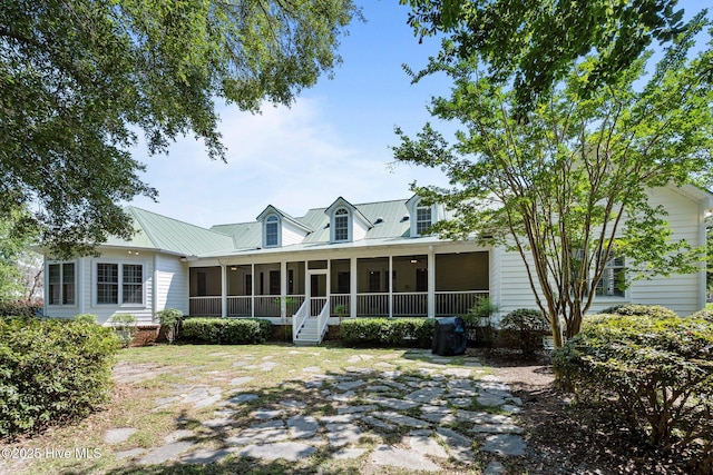 103 Low Country Ct, Hampstead, NC 28443 - rear view of house featuring a sunroom and metal roof
