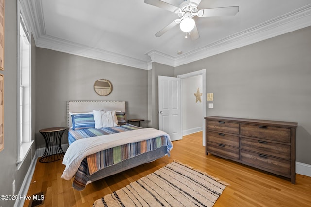 103 Low Country Ct, Hampstead, NC 28443 - bedroom featuring light wood finished floors, ornamental molding, baseboards, and a ceiling fan