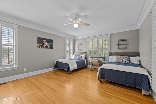 103 Low Country Ct, Hampstead, NC 28443 - bedroom featuring light wood finished floors, crown molding, a ceiling fan, and baseboards