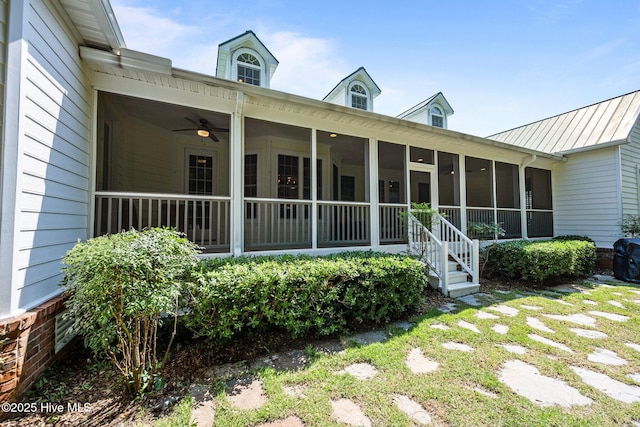 103 Low Country Ct, Hampstead, NC 28443 - rear view of property with a sunroom, metal roof, ceiling fan, and a standing seam roof