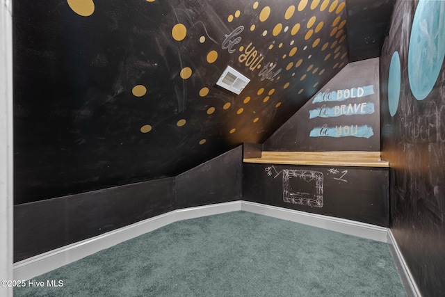 103 Low Country Ct, Hampstead, NC 28443 - carpeted home theater room with lofted ceiling and baseboards