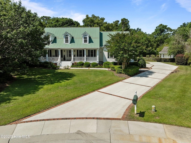 103 Low Country Ct, Hampstead, NC 28443 - cape cod-style house featuring a porch, a front yard, and metal roof