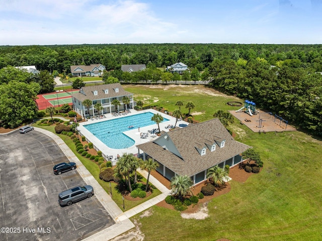 103 Low Country Ct, Hampstead, NC 28443 - bird's eye view of a pool and a forest