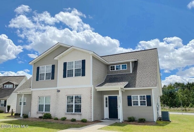 2300 Chavis Dr Unit A & B, Greenville, NC 27858 - view of front facade featuring a front yard, brick siding, and a shingled roof