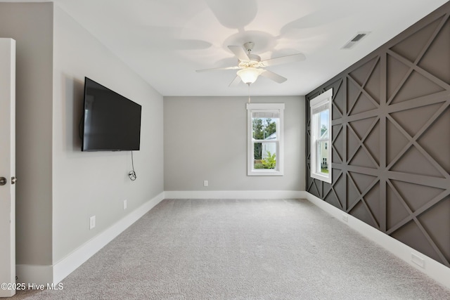 749 Cypress Village Pl, Wilmington, NC 28412 - spare room featuring a ceiling fan, baseboards, and carpet flooring