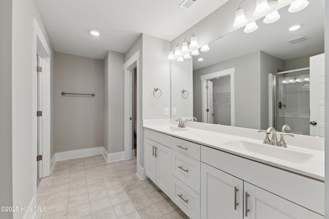 749 Cypress Village Pl, Wilmington, NC 28412 - bathroom featuring a stall shower, a spacious closet, double vanity, tile patterned flooring, and recessed lighting