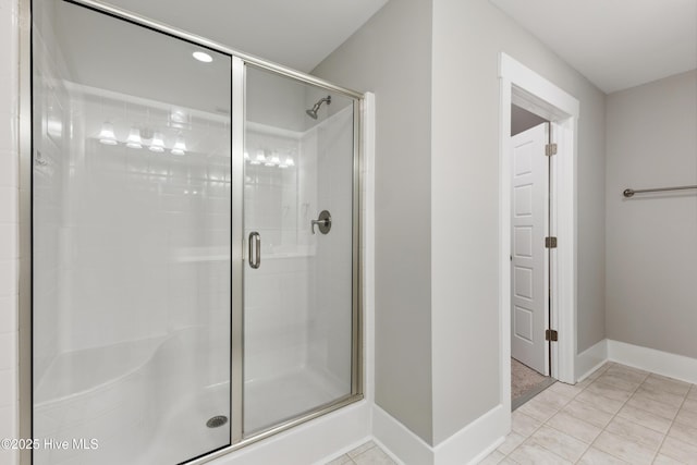 749 Cypress Village Pl, Wilmington, NC 28412 - full bathroom featuring a shower stall, baseboards, and tile patterned flooring
