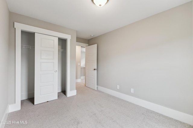 749 Cypress Village Pl, Wilmington, NC 28412 - unfurnished bedroom featuring carpet floors, a closet, and baseboards