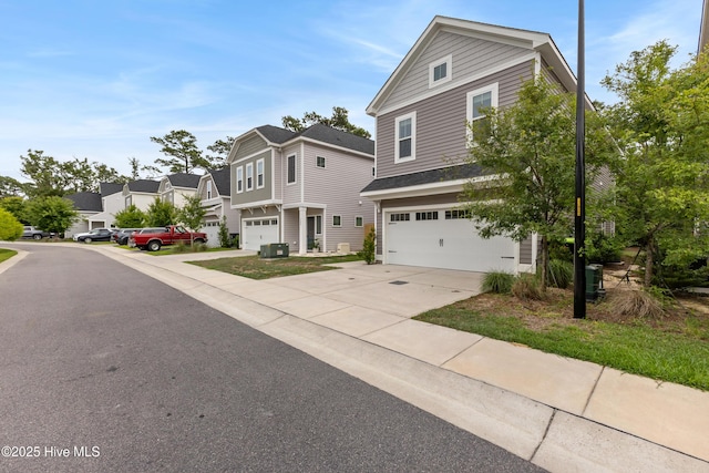 749 Cypress Village Pl, Wilmington, NC 28412 - view of front of house featuring an attached garage, driveway, a residential view, and central air condition unit