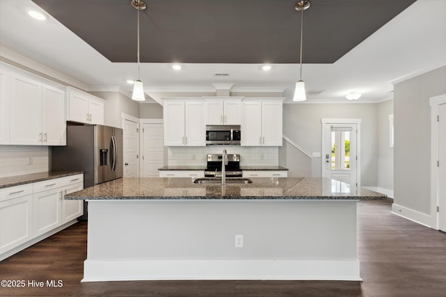 749 Cypress Village Pl, Wilmington, NC 28412 - kitchen featuring appliances with stainless steel finishes, a sink, crown molding, tasteful backsplash, and white cabinets