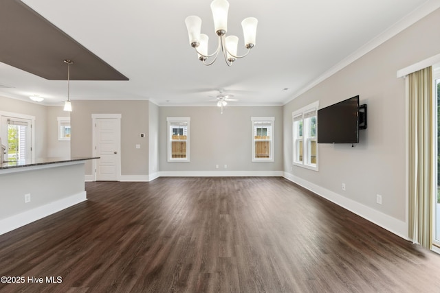 749 Cypress Village Pl, Wilmington, NC 28412 - unfurnished living room featuring dark wood-style flooring, crown molding, healthy amount of natural light, and baseboards