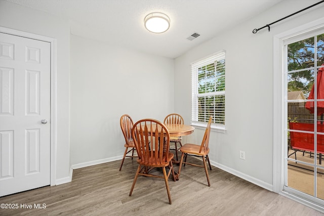 1182 Amber Pines Dr, Leland, NC 28451 - dining space featuring wood finished floors and baseboards