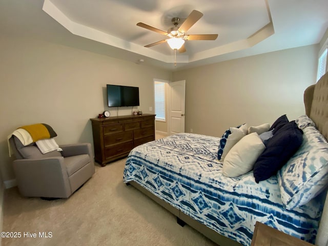 4224 Pegasus Pkwy, Leland, NC 28451 - bedroom with a raised ceiling, light colored carpet, and a ceiling fan