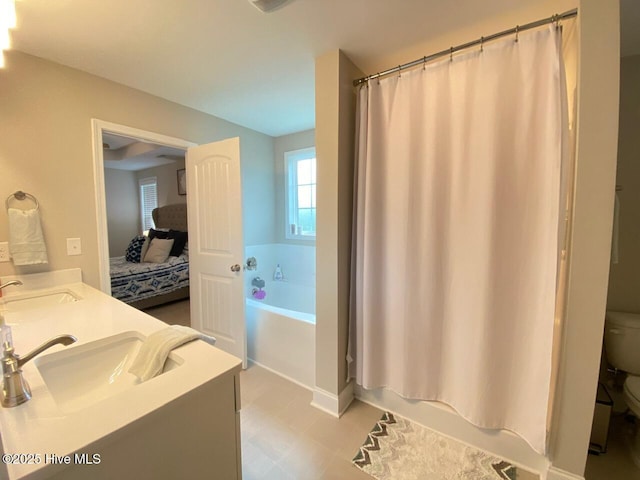 4224 Pegasus Pkwy, Leland, NC 28451 - bathroom with a bath, toilet, double vanity, and a shower with shower curtain