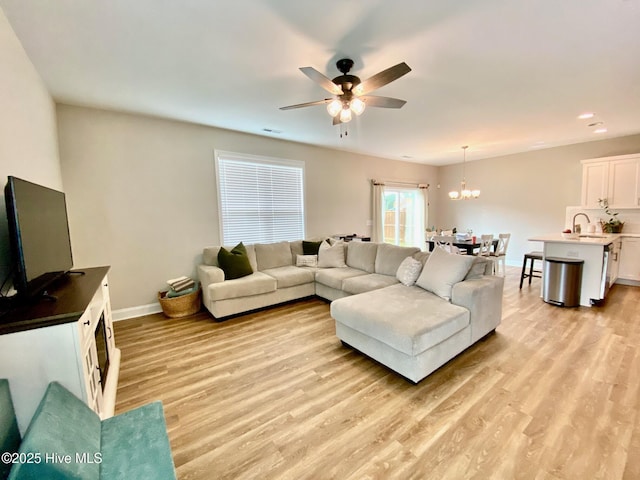 4224 Pegasus Pkwy, Leland, NC 28451 - living area with light wood-type flooring, ceiling fan, a chandelier, baseboards, and recessed lighting
