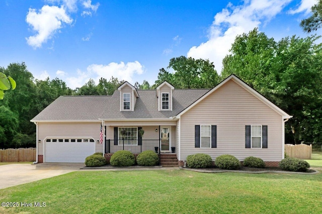208 N Woodridge Dr, Pikeville, NC 27863 - cape cod-style house with covered porch, an attached garage, driveway, and a shingled roof