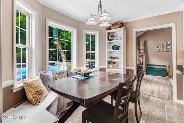 208 N Woodridge Dr, Pikeville, NC 27863 - dining room featuring a chandelier and crown molding