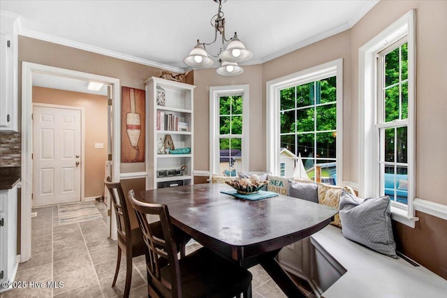 208 N Woodridge Dr, Pikeville, NC 27863 - dining room with ornamental molding and a chandelier