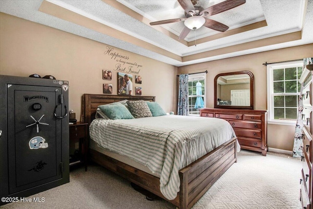 208 N Woodridge Dr, Pikeville, NC 27863 - bedroom featuring light carpet, a raised ceiling, a ceiling fan, and ornamental molding