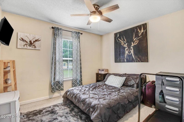 208 N Woodridge Dr, Pikeville, NC 27863 - bedroom featuring carpet, baseboards, a textured ceiling, and a ceiling fan