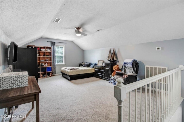 208 N Woodridge Dr, Pikeville, NC 27863 - bedroom featuring vaulted ceiling, carpet floors, a textured ceiling, and ceiling fan