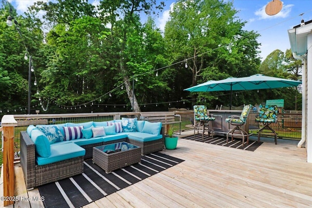 208 N Woodridge Dr, Pikeville, NC 27863 - deck with an outdoor living space and view of scattered trees
