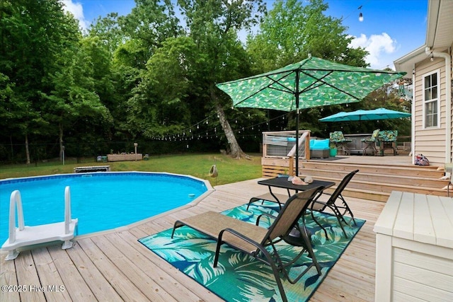 208 N Woodridge Dr, Pikeville, NC 27863 - outdoor pool featuring a deck