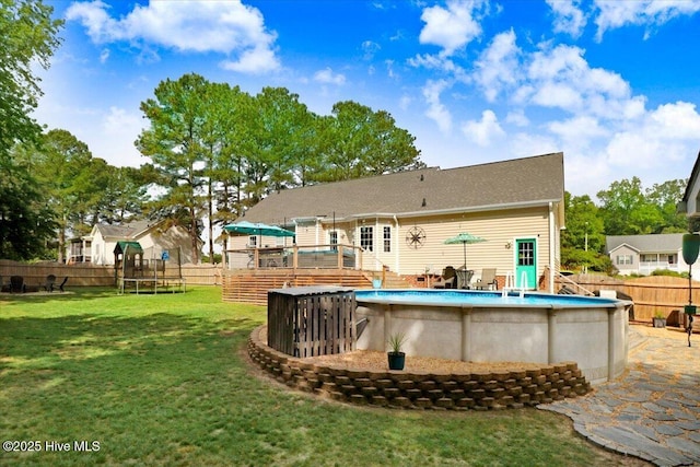 208 N Woodridge Dr, Pikeville, NC 27863 - view of pool featuring a trampoline and a deck