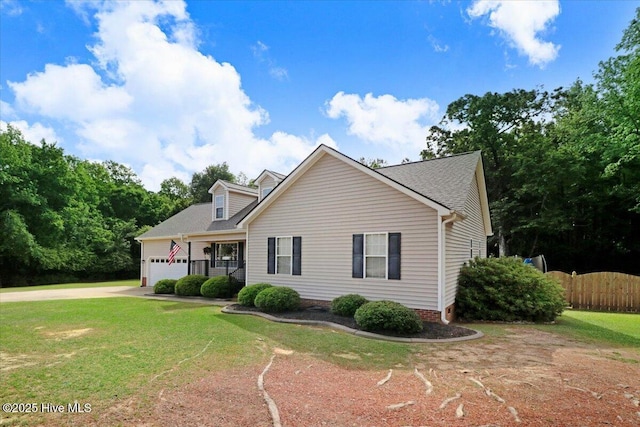 208 N Woodridge Dr, Pikeville, NC 27863 - view of front of house with driveway and an attached garage