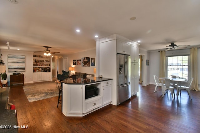 114 Lansdowne Rd, Wilmington, NC 28409 - kitchen featuring stainless steel fridge, a ceiling fan, black microwave, dark countertops, and recessed lighting