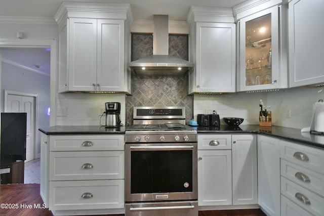 114 Lansdowne Rd, Wilmington, NC 28409 - kitchen with wall chimney exhaust hood, gas stove, ornamental molding, backsplash, and white cabinetry