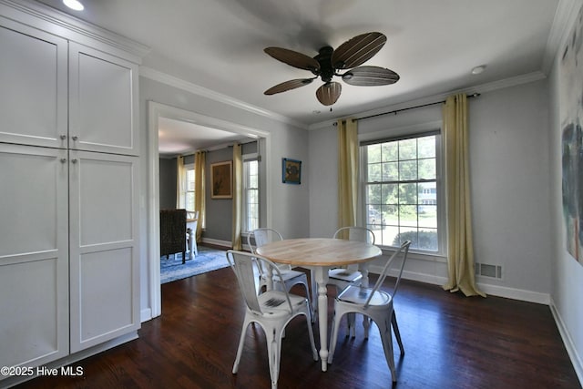 114 Lansdowne Rd, Wilmington, NC 28409 - dining space featuring baseboards, dark wood-type flooring, a ceiling fan, and ornamental molding