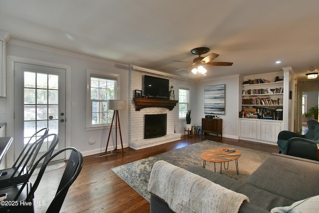 114 Lansdowne Rd, Wilmington, NC 28409 - living area with plenty of natural light, crown molding, a ceiling fan, wood finished floors, and baseboards