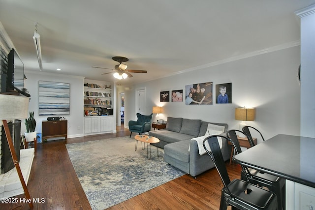114 Lansdowne Rd, Wilmington, NC 28409 - living area with a ceiling fan, ornamental molding, wood finished floors, a brick fireplace, and built in shelves