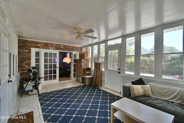 114 Lansdowne Rd, Wilmington, NC 28409 - sunroom with tile patterned flooring, french doors, and brick wall