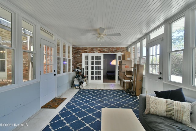 114 Lansdowne Rd, Wilmington, NC 28409 - sunroom featuring tile patterned floors, a ceiling fan, and brick wall