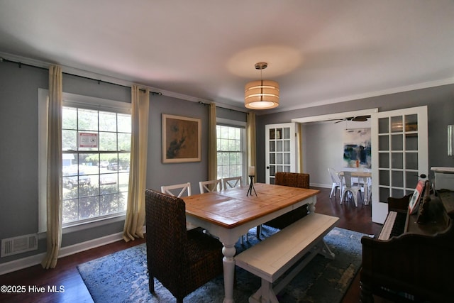 114 Lansdowne Rd, Wilmington, NC 28409 - dining area with dark wood-style floors, baseboards, a ceiling fan, and crown molding