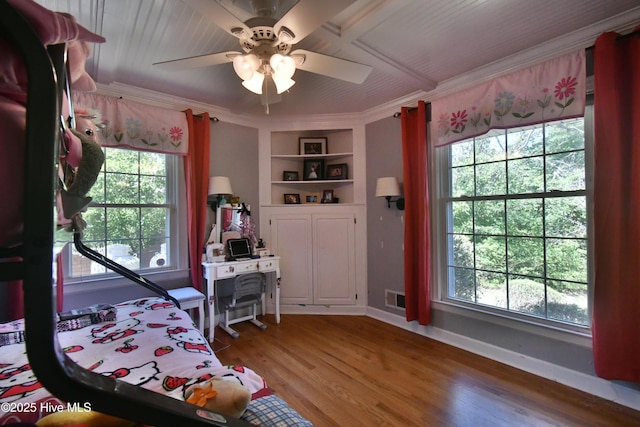 114 Lansdowne Rd, Wilmington, NC 28409 - bedroom featuring crown molding, baseboards, wood finished floors, and ceiling fan