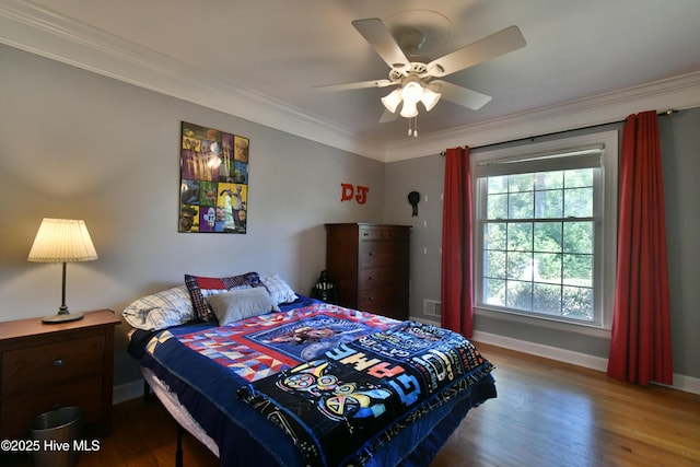 114 Lansdowne Rd, Wilmington, NC 28409 - bedroom featuring wood finished floors, multiple windows, ornamental molding, baseboards, and a ceiling fan