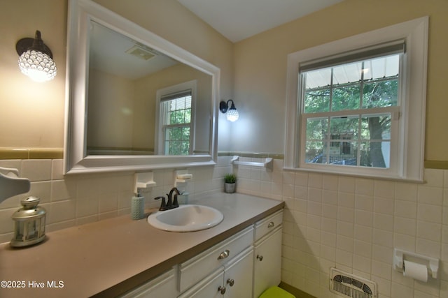 114 Lansdowne Rd, Wilmington, NC 28409 - bathroom featuring tile walls, vanity, and a wainscoted wall