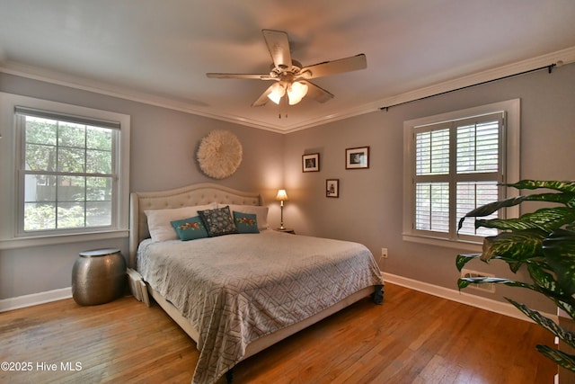 114 Lansdowne Rd, Wilmington, NC 28409 - bedroom with baseboards, hardwood / wood-style floors, ornamental molding, and ceiling fan