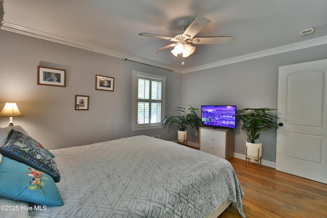114 Lansdowne Rd, Wilmington, NC 28409 - bedroom with wood finished floors, crown molding, baseboards, and a ceiling fan