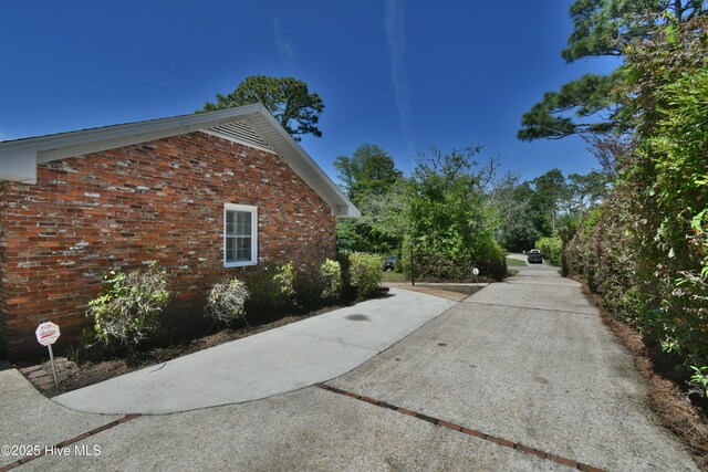 114 Lansdowne Rd, Wilmington, NC 28409 - view of home's exterior featuring brick siding