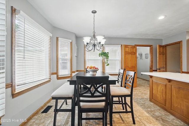 145 N Point Blvd, Moyock, NC 27958 - dining room featuring a chandelier, healthy amount of natural light, light tile patterned floors, baseboards, and recessed lighting