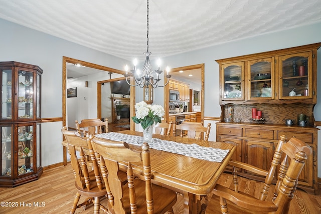 145 N Point Blvd, Moyock, NC 27958 - dining area featuring a chandelier and light wood-style flooring