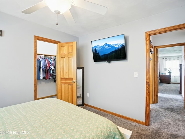 145 N Point Blvd, Moyock, NC 27958 - bedroom featuring carpet, a spacious closet, baseboards, a closet, and ceiling fan