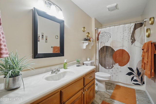 145 N Point Blvd, Moyock, NC 27958 - full bathroom with vanity, toilet, a shower with shower curtain, and stone finish floors