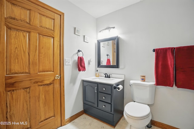 145 N Point Blvd, Moyock, NC 27958 - half bathroom featuring baseboards, vanity, toilet, and tile patterned floors