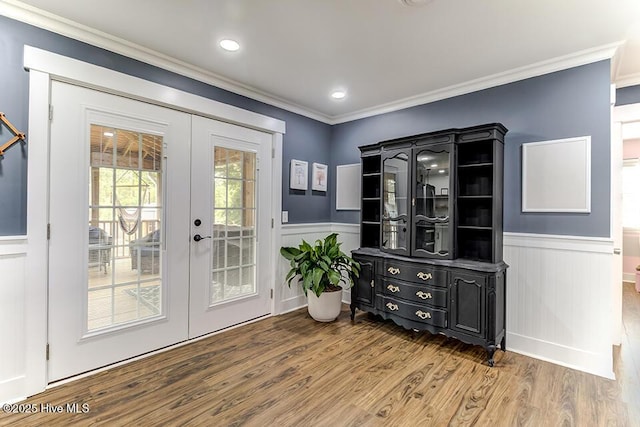 4838 Stillwell Rd, Wilmington, NC 28412 - doorway to outside featuring french doors, wood finished floors, wainscoting, and ornamental molding