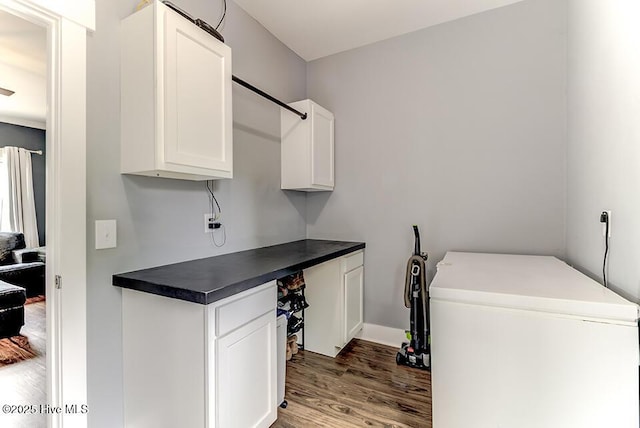 4838 Stillwell Rd, Wilmington, NC 28412 - laundry area with wood finished floors and baseboards